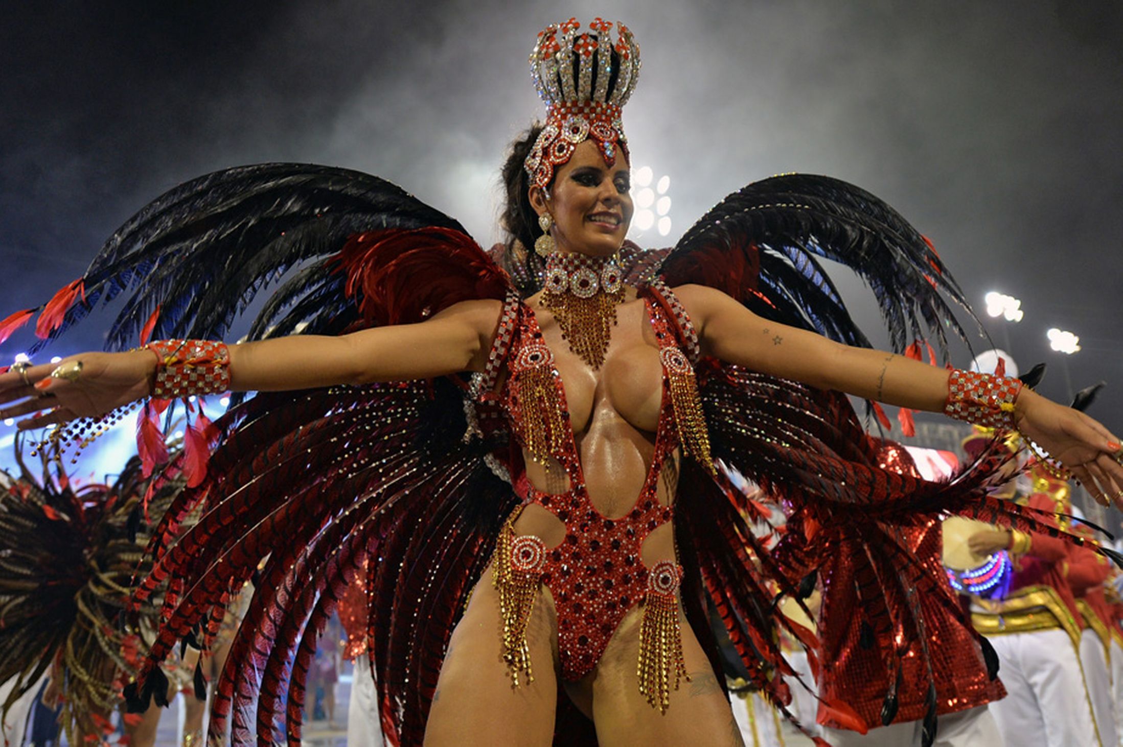 A reveler of the Perola Negra samba school performs during the second night of carnival parade at the Sambadrome in Sao Paulo, Brazil on March 1, 2014 (Photo Credit: Daily Mirror)