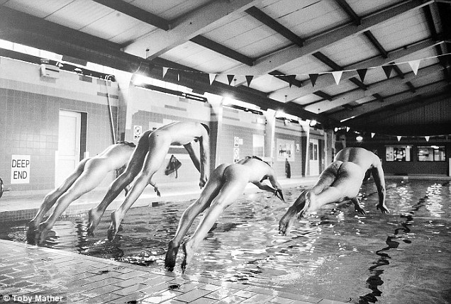 In the swim: The swimming team chose to be pictured diving naked into the University pool 
