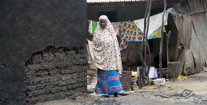 Borno Boko Haram Featured A woman stands next to a burnt house in the aftermath of what Nigerian authorities said was heavy fighting between security forces and Islamist militants in Baga