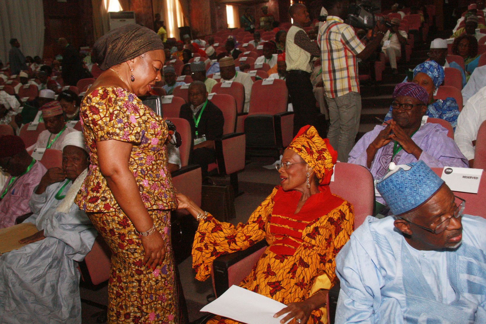 Senator Florence Ita Giwa (Standing) sharing a word with Prof. Dora Akunyili at the National Conference in Abuja (Internet Photo)