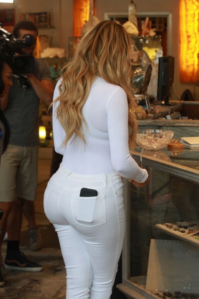 Khloe Kardashian Flaunts Major Curves As She Steps Out In All White