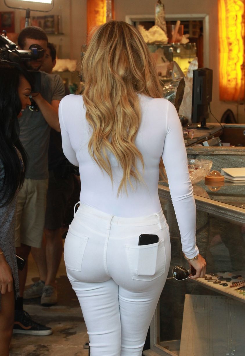 Khloe Kardashian Flaunts Major Curves As She Steps Out In All White