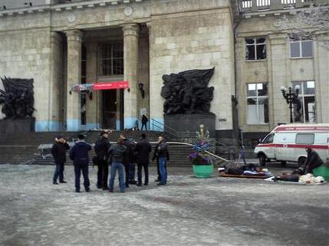 A still image taken from video shows firefighters, Emergency Ministry members and medics working outside a train station near the site of an explosion in Volgograd December 29, 2013. REUTERS/Reuters TV