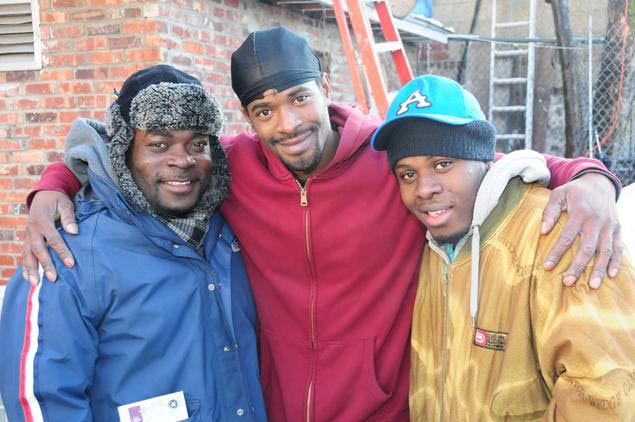 The twins' father Everdean Codner (center) says mailman Jermaine Shirley (left) and nephew Euwan Lynch are both 'heroes.'