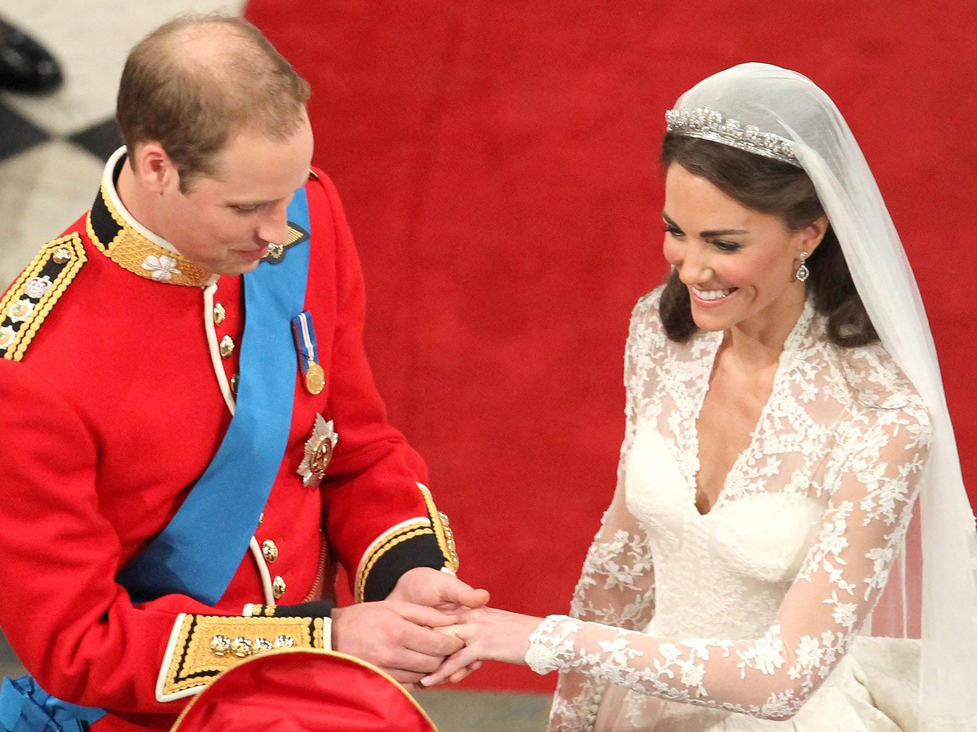 LONDON, ENGLAND - APRIL 29: Prince William exchanges rings with his bride Catherine Middleton in front of the Archbishop of Canterbury, Rowan Williams inside Westminster Abbey on April 29, 2011 in London, England. The marriage of Prince William, the second in line to the British throne, to Catherine Middleton is being held in London today. The marriage of the second in line to the British throne is to be led by the Archbishop of Canterbury and will be attended by 1900 guests, including foreign Royal family members and heads of state. Thousands of well-wishers from around the world have also flocked to London to witness the spectacle and pageantry of the Royal Wedding. (Photo Credit: Andrew Milligan - WPA Pool/Getty Images)