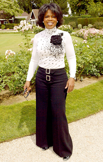 July 2004: Winfrey in Paris at the Christian Dior Haute Couture fashion show (Photo Credit: Tony Barson/WireImage.com)