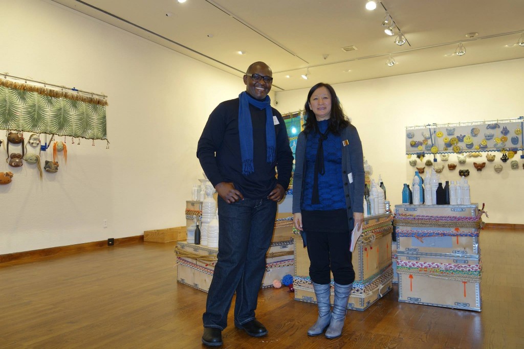 Victor Ekpuk with Yoko Inoue at her installation "Mandala Flea Market" (Photo Credit: Art of Victor Ekpuk/Facebook)