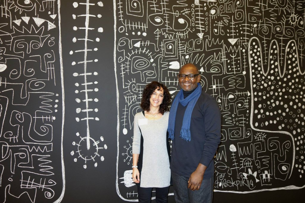 Victor Ekpuk with Curator Allyson Purpura — at Krannert Art Museum and Kinkead Pavilion.  (Photo Credit: Art of Victor Ekpuk/Facebook)