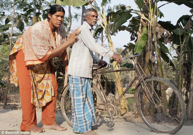 Daddy's big girl: Siddiqa is pictured with her father who still cares for his adult daughter (Photo Credit: Daily Mail)
