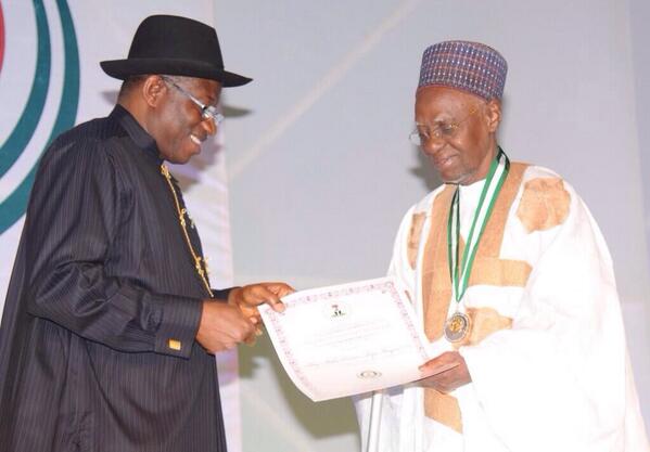 Former President Shehu Shagari receiving his award from President Jonathan at the centenary awards.
