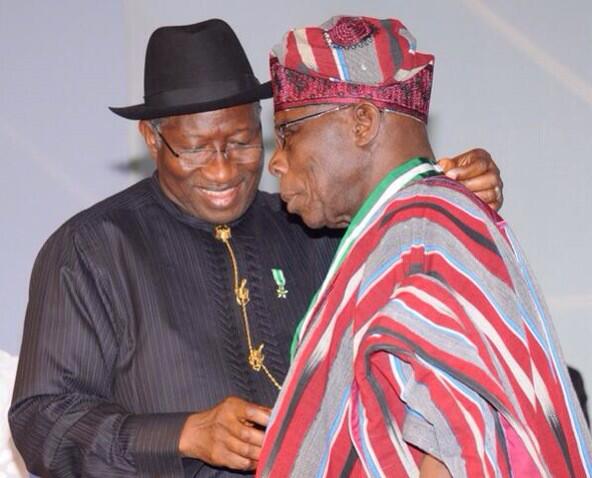 Former President Obasanjo receiving his award from President Jonathan at the Centenary Awards ceremony