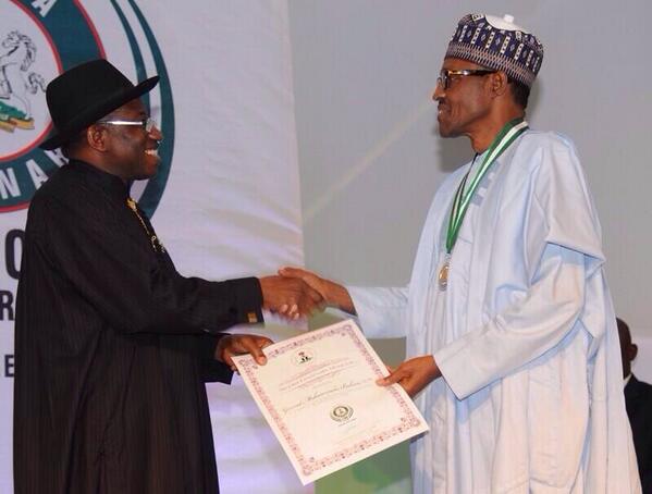 Gen Muhammadu Buhari receiving his award from President Jonathan at the Centenary Awards ceremony
