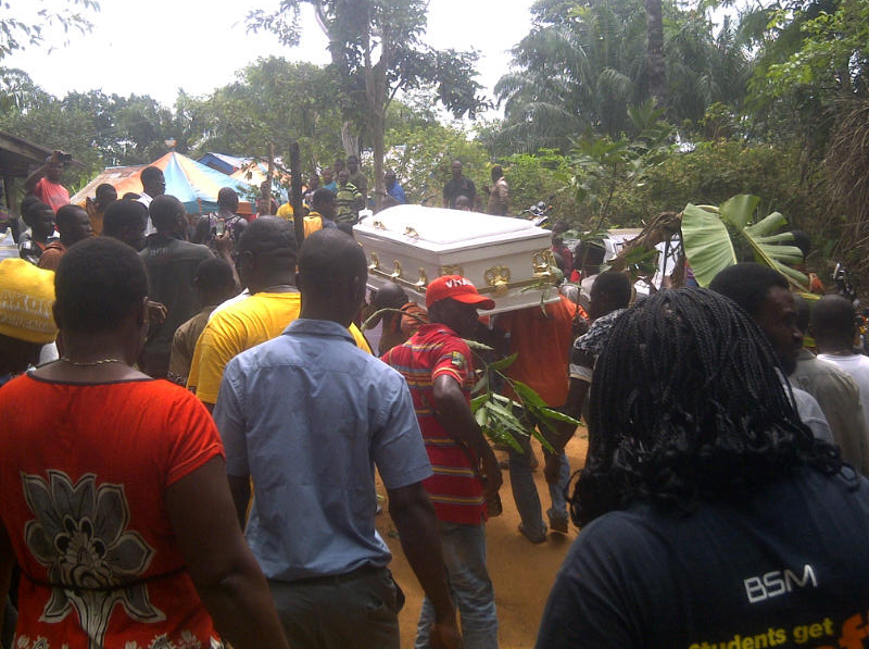 MARCH 8, 2014: Youths bring in the corpse into the Prime Minister's compound from the mortuary in Mgbee, Orlu LGA, Imo State (Photo Credit: Douglas Nwune/The Trent)