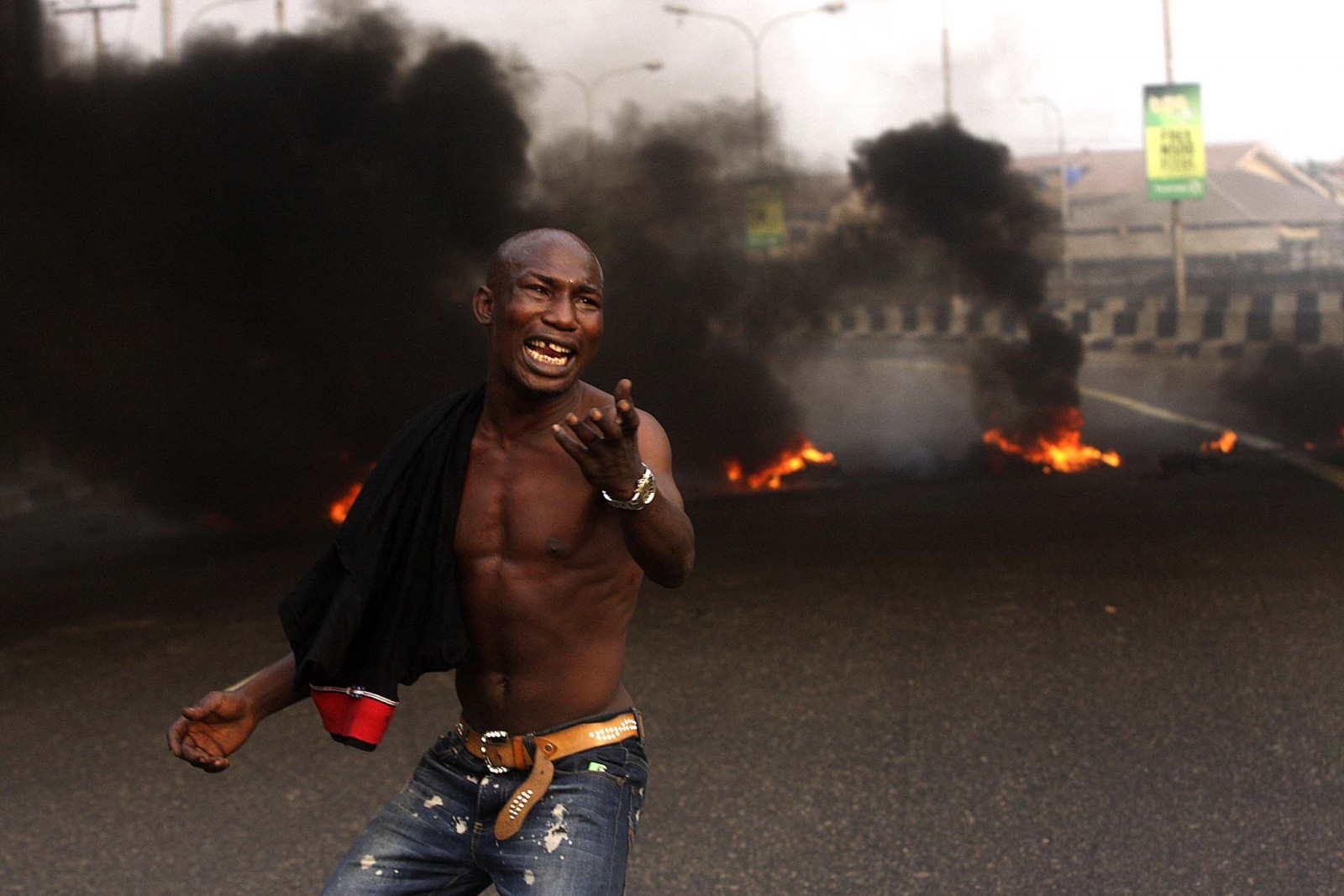 Enugu, A angry youth protests in front