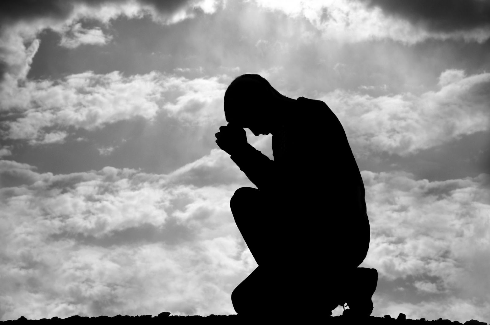 humility silhouette kneeling man praying man prayer the trent - The Trent