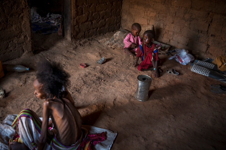 Near Bangui. Fatimatou Moussa (about 40) is a displaced peul very sick. She suspected to have TB and maybe other disease. She stays now in the PK12 muslim enclave with very small access to health. MSF has osculted her but there is no place in Bangui able to treat such case and to know what she suffers from she should go to the center, which is too dangerous for muslims. In PK12 enclave, about 2000 displaced muslims took refuge. They are mostly Peul nomadic tribes who escaped fighting in the bush. Any muslims trying to get out of the neighborhood is attacked by antibalakas. Food and access to health is very low. (Photo Credit: William Daniels/Panos)