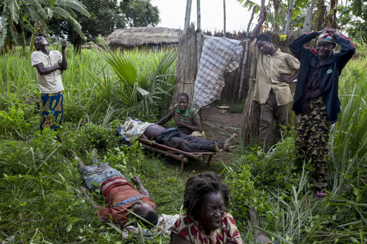 Gulinga, 5 km of Grimari. Relatives cry the death of 2 men and one woman slaughtered just before by ex Seleka fighters in the village of Gulinga, accusing them of being Antibalakas. The woman was killed as a "collateral damage" according to a Seleka colonel who admitted the killing. Grimari is being attacked by Antibalakas for 2 days as it is the gate to the Ouaka region that is still controlled by Seleka fighters whose general Mahamat Darrassa is relatively appreciated bu both muslims and christians for having fought and pushed away others Seleka who were installing terror among the city communities. Sangaris troops trust him, thinking he is the only way to keep Ouaka region out of violence. (Photo Credit: William Daniels/Panos)