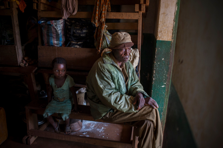 Grimari. Aman and his daughter took refuge in a classroom of the catholic mission of Grimari. 4800 displaced christians took refugee there to flee the fighting between ex Seleka and Antibalakas, Grimari is being attacked by Antibalakas for 2 days as it is the gate to the Ouaka region that is still controlled by ex Seleka fighters whose general Ali Mahamat Darrassa is relatively appreciated by both muslims and christians for having fought and expelled others Seleka who were installing terror among the city communities. Sangaris troops trust him, thinking he is the only way to keep Ouaka region out of violence between christians and muslims. (Photo Credit: William Daniels/Panos)