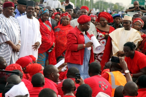 The #BringBackOurGirls protests in Abuja yesterday, May 22, 2014. Pictured with a microphone is former VP of the World Bank, Oby Ezekwesili and Minister of Information Labaran Makun (In black cap) and other government officials in the background (Photo Credit: Sahara Reporters)