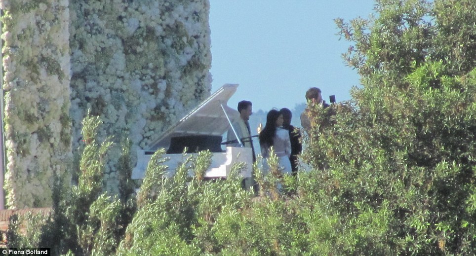 Kim Kardashian snapped from a distance at the altar with Kanye West