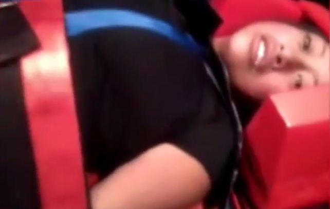 Her arm and hand goes into involuntary spasm