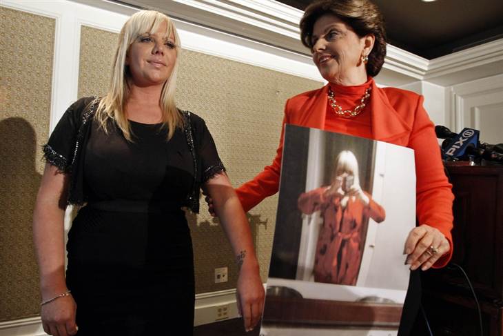 Lauren Odes and her attorney Gloria Allred (R) speak at a news conference in New York, May 21, 2012. Odes is suing her former employer, caliming she was dismissed for dressing too provocatively. (Photo Credit: Brendan Mcdermid/Reuters)