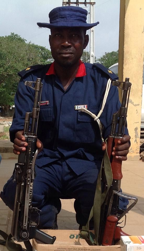Arrested suspect, NSCDC ASC Idris Saidu with AK-47 Rifles recovered from him on July 22, 2014 in Minna (Photo Credit: NPF News)