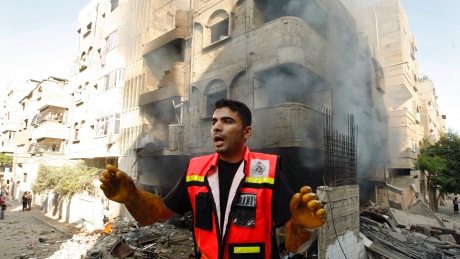 Israel dramatically escalates its aerial assault in Gaza, hitting hundreds of Hamas targets, as Palestinians report 16 people killed in strikes that hit a home and a beachside cafe