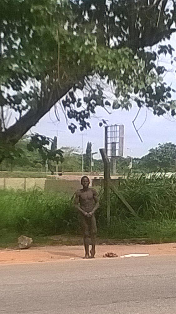 The 22-year-old Boko Haram suicide bombing suspect captured on surveillance video as he undressed and attempted to wear his bomb. He was arrested at the Lagos Airport August 19, 2014 (Photo Credit: The Trent/BAB)