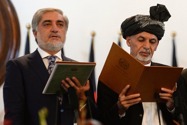 President Ashraf Ghani of Afghanistan, right, and the country's new chief executive, Abdullah Abdullah, at Mr. Ghani's swearing-in ceremony in the capital, Kabul, on Monday. (Photo Credit : Shah Marai/Agence France-Presse — Getty Images)