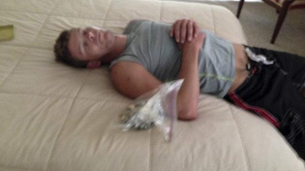 an alleged Florida burglar who apparently fell asleep on the job is getting a lot of attention after deputies say they snapped a picture of him asleep in the victim's home (Photo Credit: AP Photo/Sarasota County Sheriff's Office)