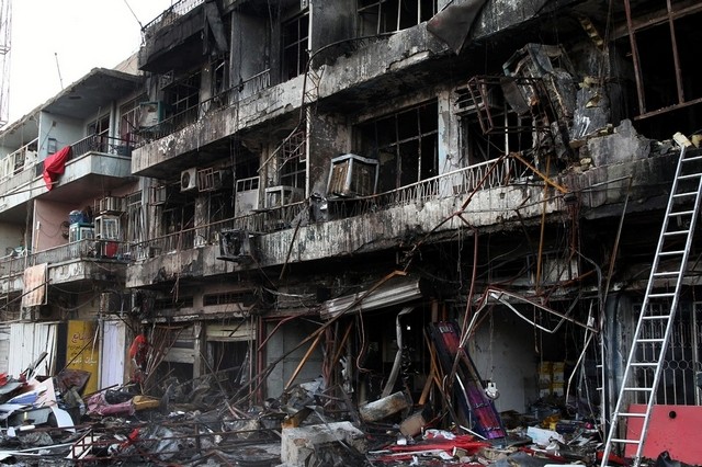 A View Of Shattered Buildings After A Car Bomb Attack At Sinaa In Central Baghdad, Iraq. On Saturday, November 8, 2014 (Photo Credit:Ali Abbas/EPA)
