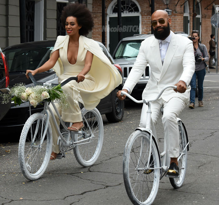 Solange-and-Alan-Ferguson-arrive-on-bikes-to-their-wedding