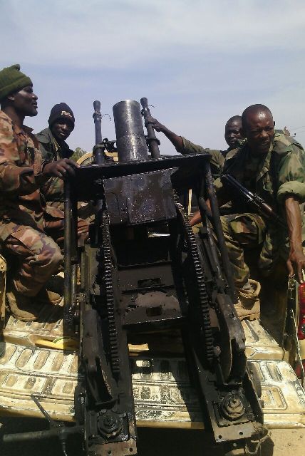 Troops with one of the captured weapons