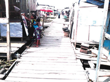 The scene of the incident at Apapa-Iganmu area of Lagos where three persons including, Jamiu, Kazeem Ayinde and another unidentified victim were killed in a cult clash. (Photo Credit: Punch)
