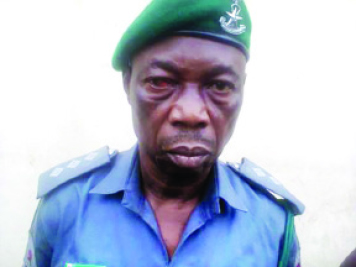 Mr Raji who posed as a Senior Customs officer to defraud people in Lagos state, (Photo Credit: Sun)