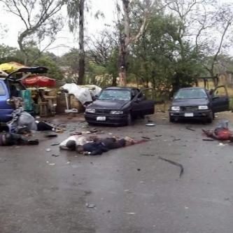 Bodies at the scene of the explosion in Jos (Photo Credit: The Scoop)