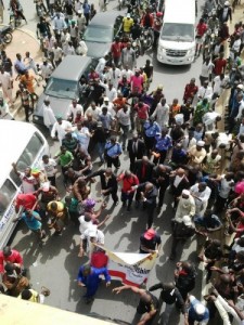 "The Traveller surrounded by Buhari supporters" Photo Credit: Daily Post