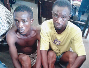 Two suspects who were arrested for allegedly killing a 43-year-old taxi driver, Tunde Adetola because he beat up an epileptic patient during a disagreement in Onipanu area of Lagos State on Sunday, April 19, 2015. (Photo Credit: Punch)