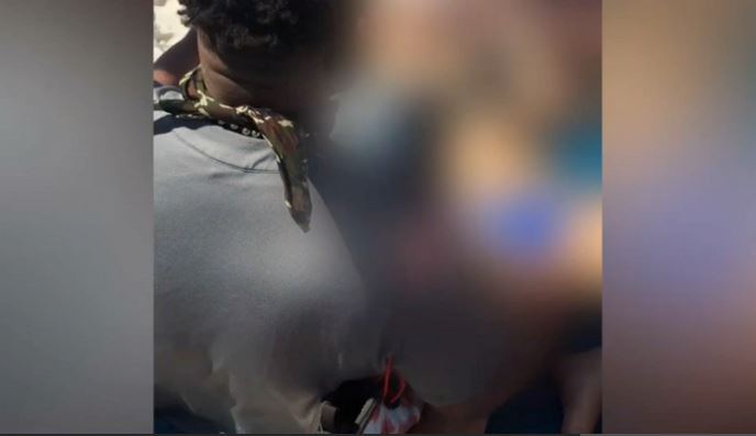 Police blurred out this graphic image of the victim, who was allegedly sitting passed out behind a Panama City Beach bar.