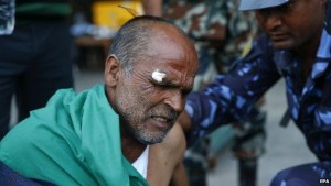 An injured man is treated at Kathmandu airport
