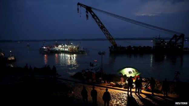 Rescuers still at work even as night falls (Credit: BBC/AFP)