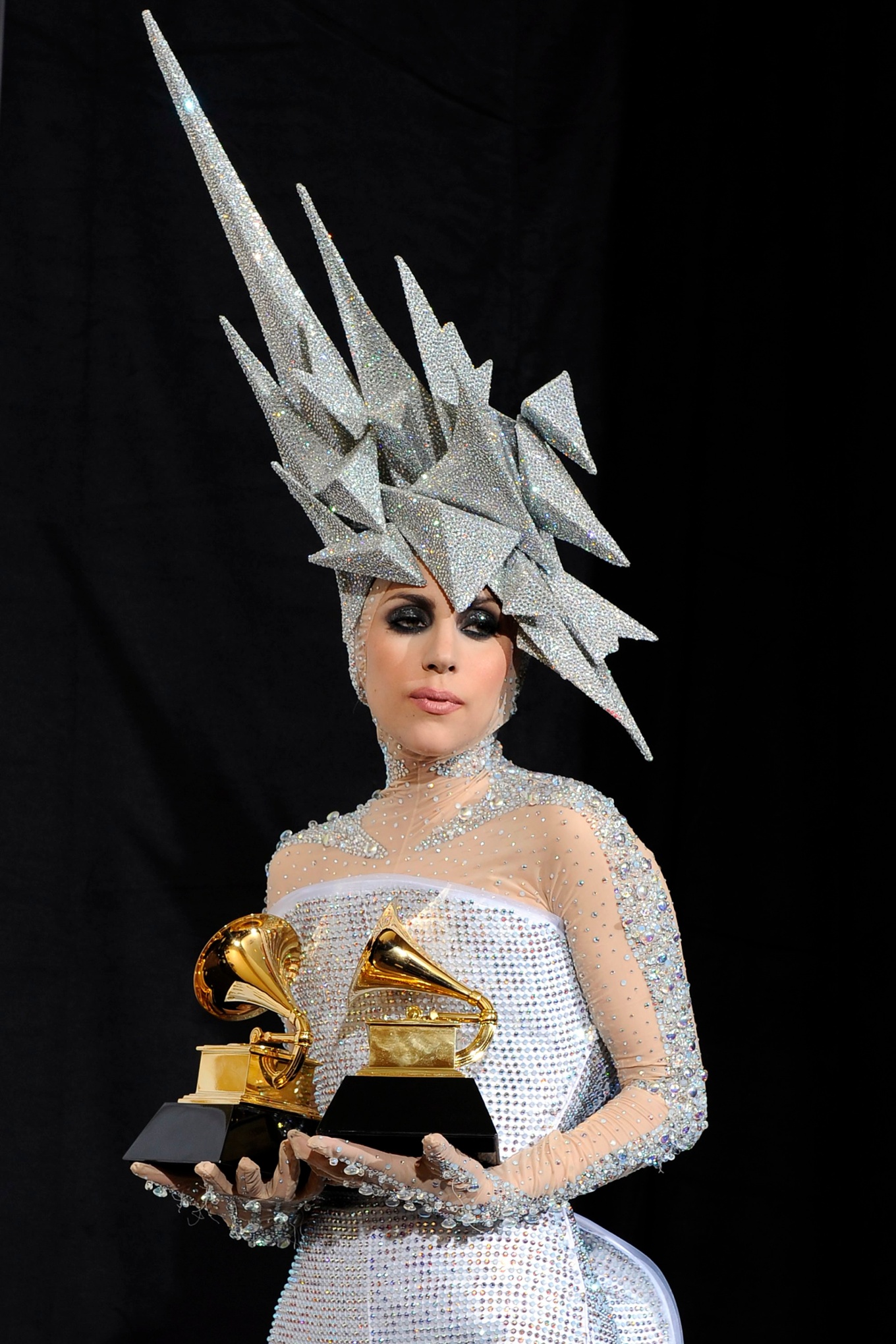 epa02399284 YEARENDER 2010 JANUARY Singer Lady Gaga of the US, holds up her awards for Best Dance Recording and Best Electronic/Dance Album at the 52nd Annual Grammy Awards at the Staples Center in Los Angeles, California, USA, 31 January 2010. The Grammys are presented annually by the National Academy of Recording Arts and Sciences of the United States for outstanding achievements in the music industry. EPA/ANDREW GOMBERT