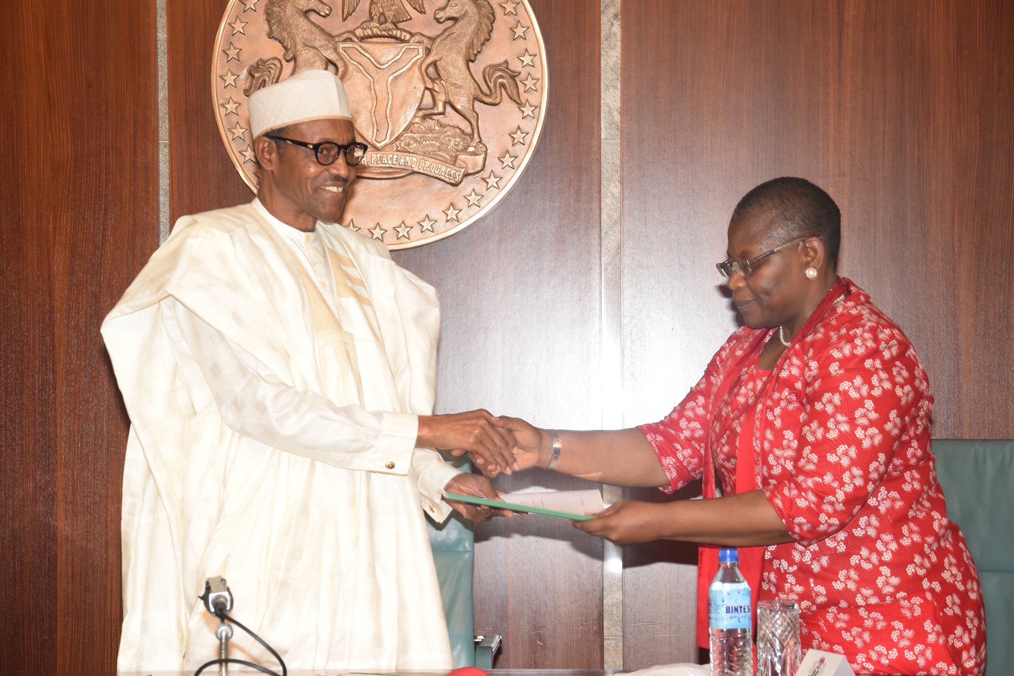 President Buhari receiving 'demands'from the leader of the Bring Back Our Girls Campaigner, Oby Ezekwesili at Aso Rock (State House Photo)