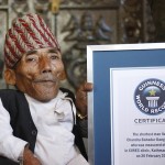 Chandra Bahadur Dangi, 72, poses for a picture with his certificate after being announced as the world’s shortest man living, as well as shortest person ever measured by the Guinness World Records, in Kathmandu
