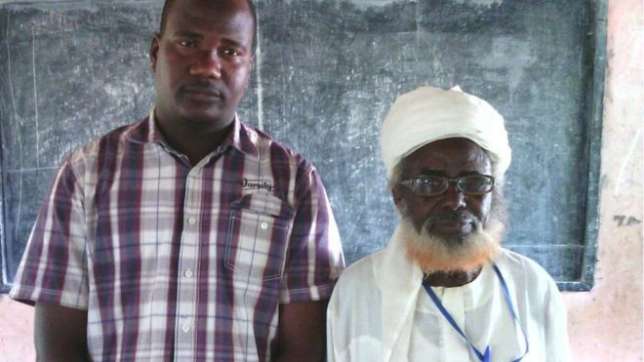 Oldest Nigerian Pupil, Mohammud Modibbo pictured with his teacher, Abdulkarim Ibrahim.