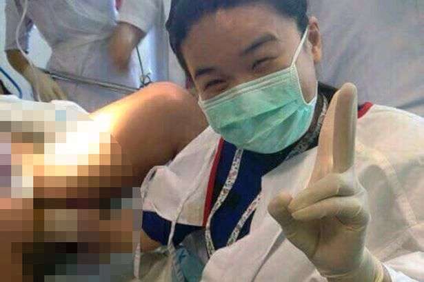 Selfie taken by doctor during surgery with her hand inside pregnant woman's vagina n Malaysia.