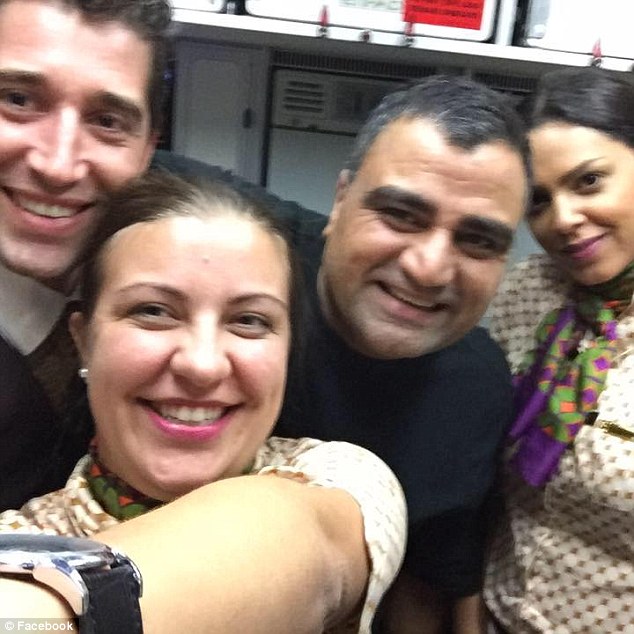 Nadeem Quraishi is pictured in the above photo with flight attendants (Photo Credit: First To Know)