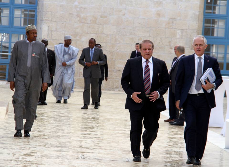 Nigeria's President Muhammadu Buhari (l) walks alone as heads of government of the Commonwealth take an outdoor walk at the CHOMG Meeting in Malta on November 28, 2015 | Facebook/Uhuru Kenyatta