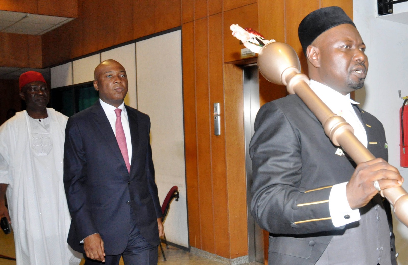 Senate President Bukola Saraki (m) going in for his first plenary session at the Senate Chamber in Abuja, Wednesday, June 10, 2015. Behind him is the deputy senate President, Ike Ekweremadu | NAN Photo